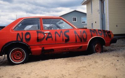 Featured Photo: “NO DAMS NO MORE” Car in Chisasibi, Cree Territory, off James Bay in Quebec, Canada (1993).